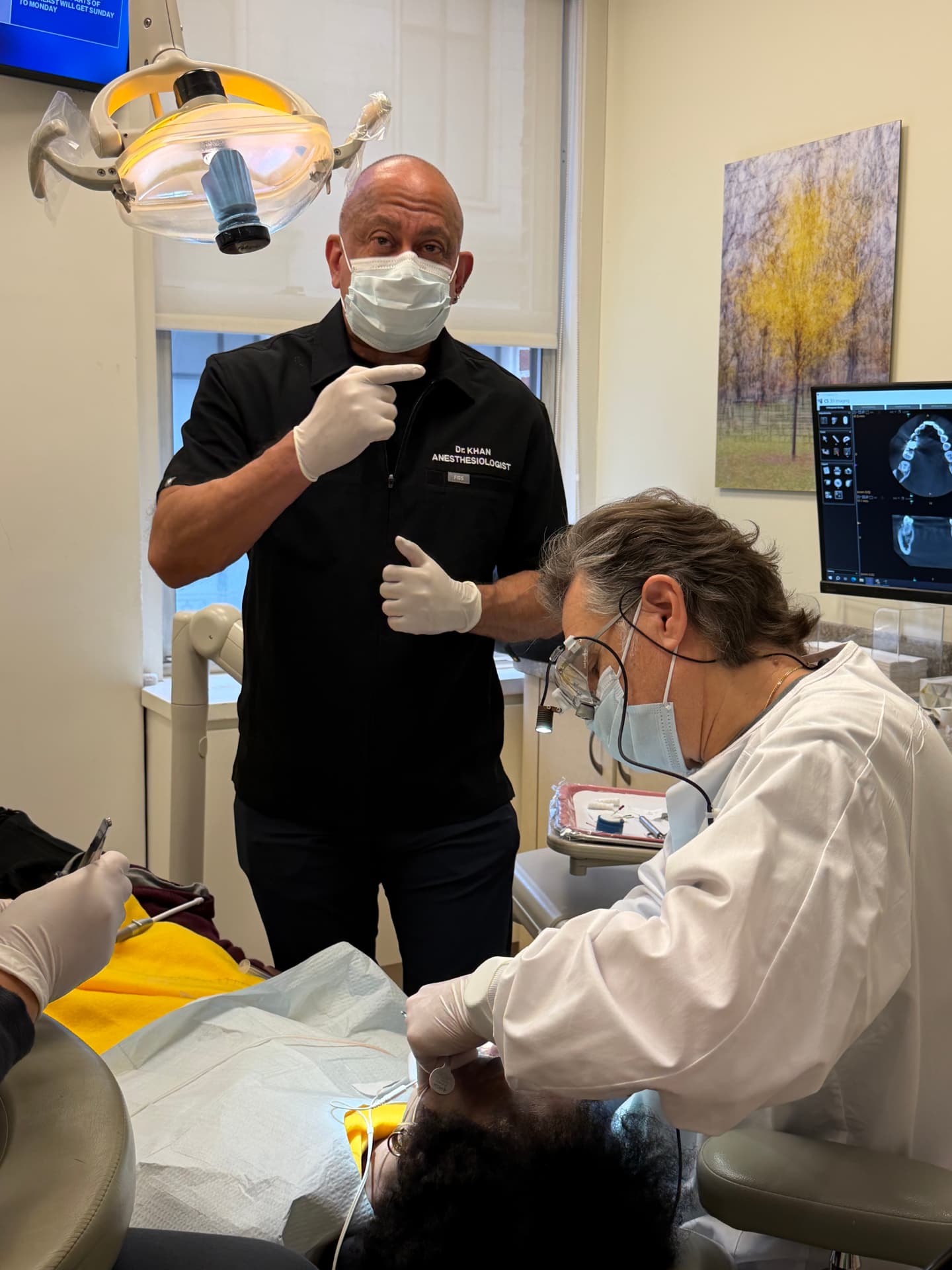Dr. Khan monitoring anesthesia during a complex dental procedure